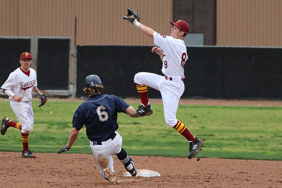 Lancers second baseman Nick Paschal ends up dropping the tag on a Merced baserunner on this caught-stealing throw by catcher Cole Pillar Sunday, photo by Richard Quinton.