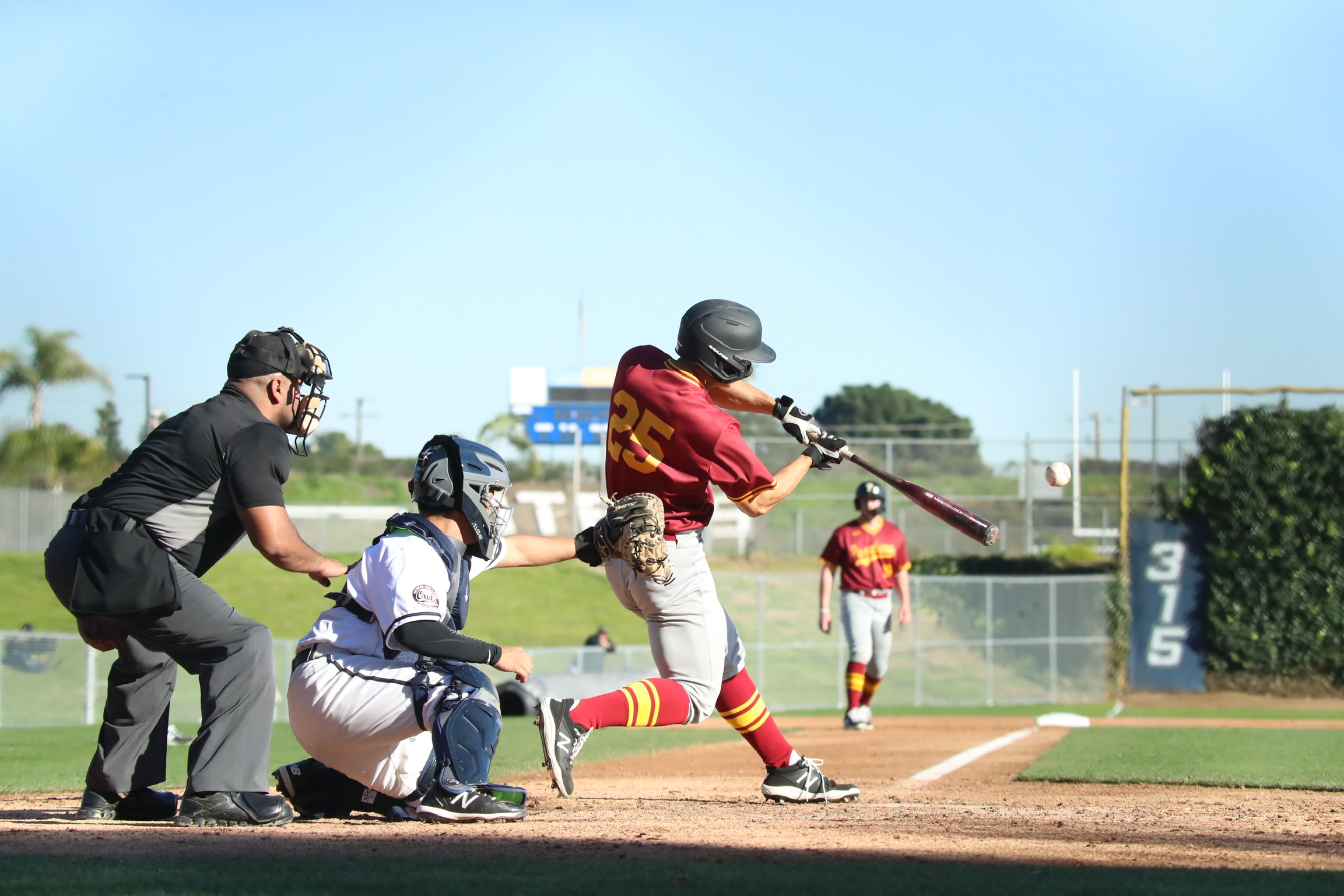 Lancer Kenny Kim drives a 3-run HR here as PCC hit the field for the first time in 2 years at Citrus College on Thursday. (photo by Michael Watkins, Athletics)