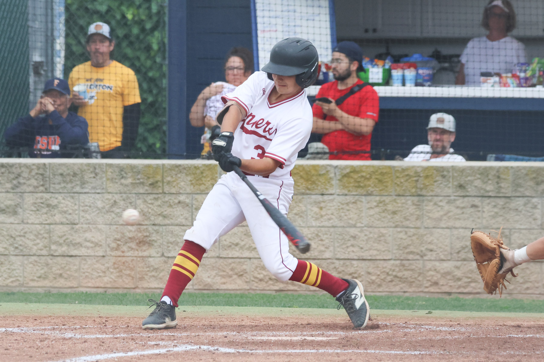 Bryan Richaman rips a triple here at Fullerton in game 2 of their playoff series on Saturday (photo by Richard Quinton).