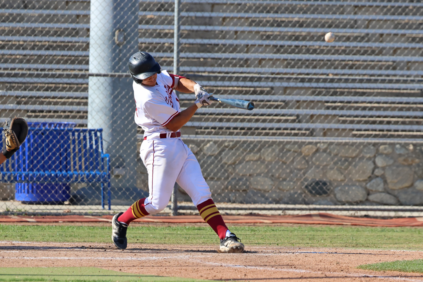 Evan Nahra slugs a home run in recent game (photo by Richard Quinton).