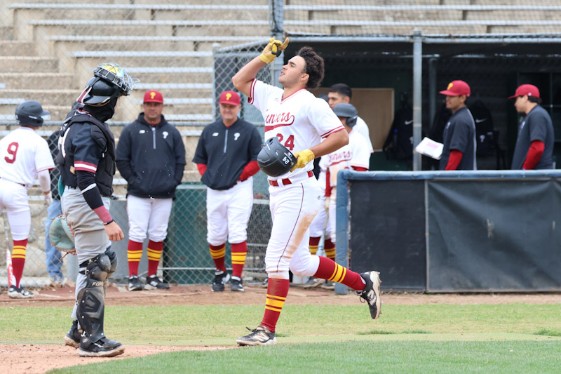 Devon Eskridge celebrates his home run as he crosses the plate on Tuesday (photo by Richard Quinton).