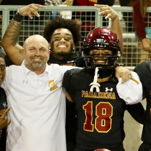 Joshua Andrade (#18) with Coach Robert Tucker has become the team's #1 quarterback after playing on scout team in the first half of the season.