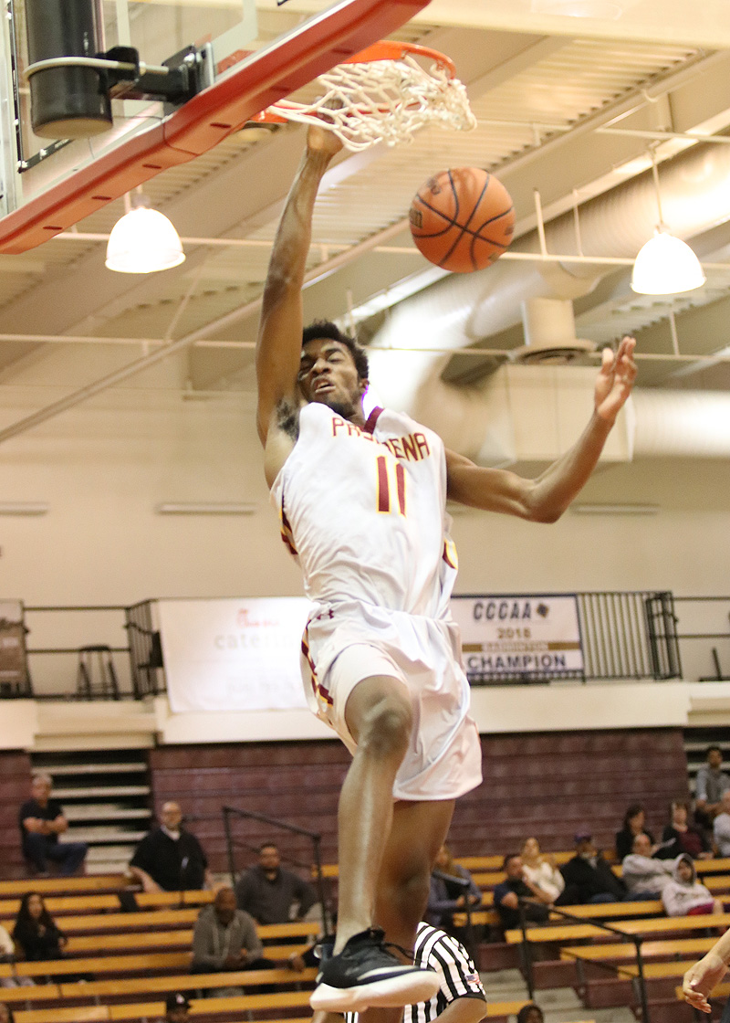 Ivan Egbunike slams in two of his 17 points in PCC's home-opening win over Pierce on Thursday evening, photo by Richard Quinton.