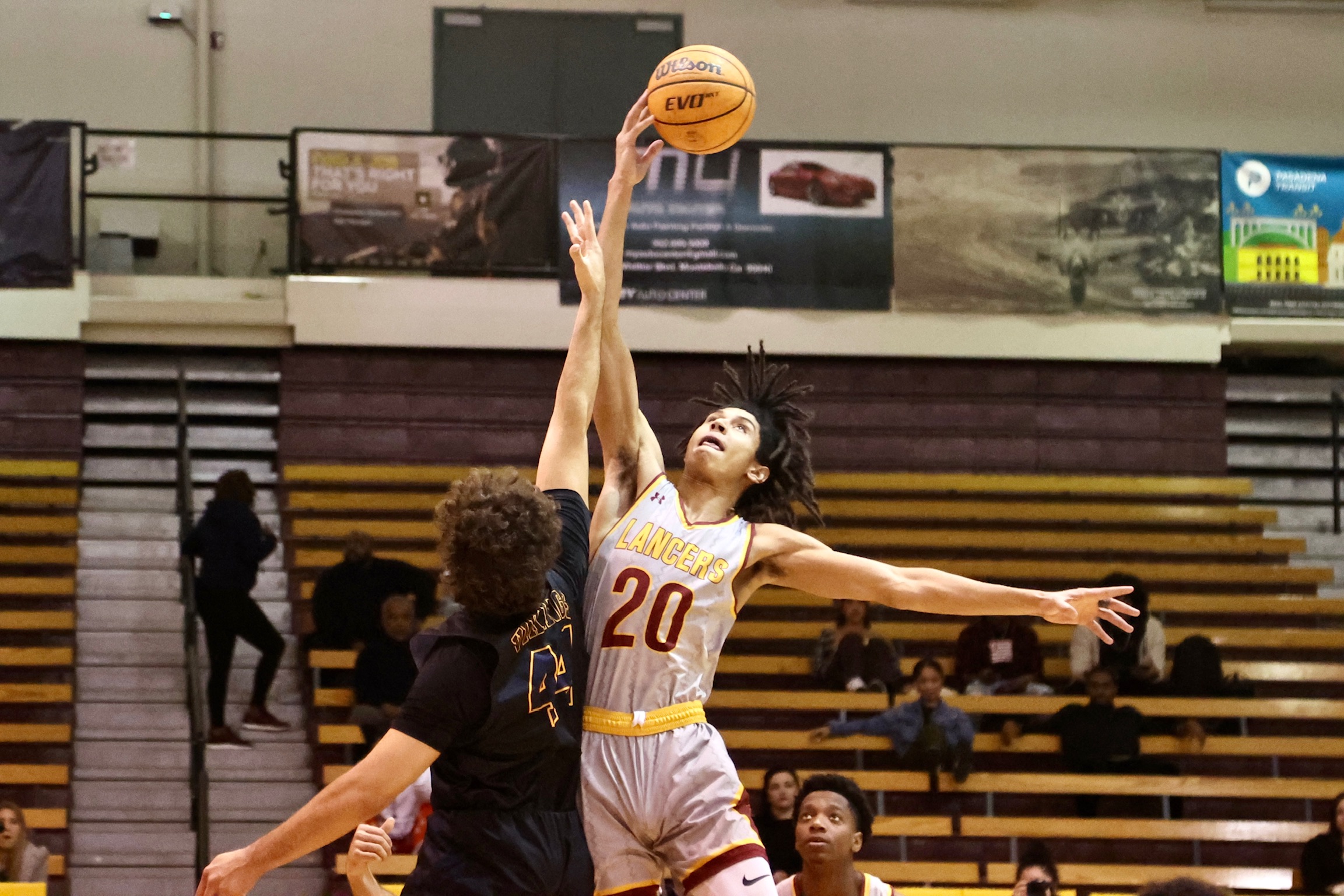 Nigel Wison goes up for the opening tip v. Barstow last Thursday (photo by Michael Watkins).