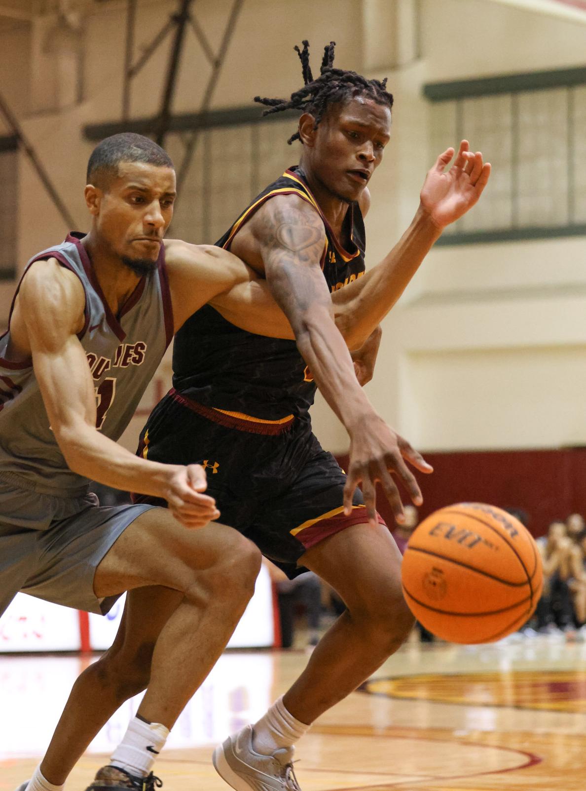 Myles Watkins battles for the ball in Friday's win (photo by Richard Quinton).
