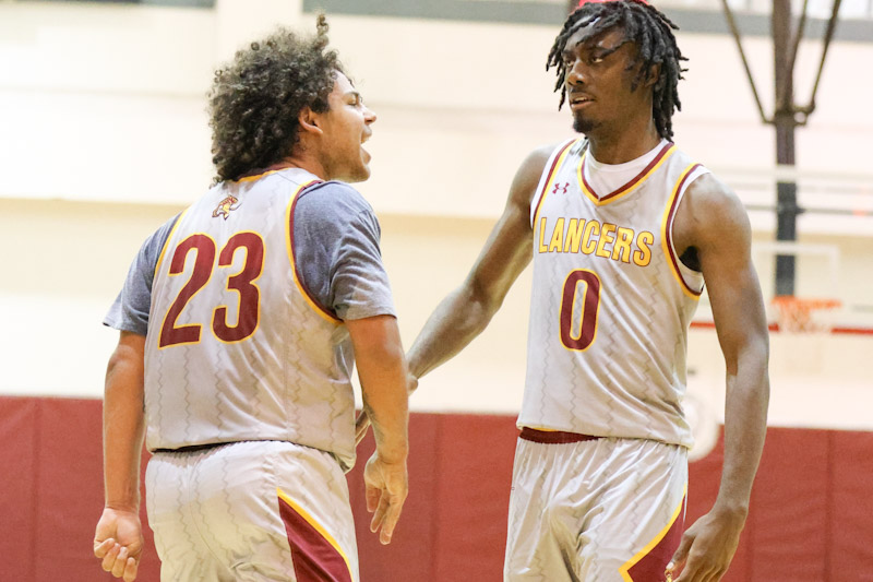 Kaiden Fine shows his excitement with Dylan Swillis (right) in PCC's Friday night win (photo by Richard Quinton).