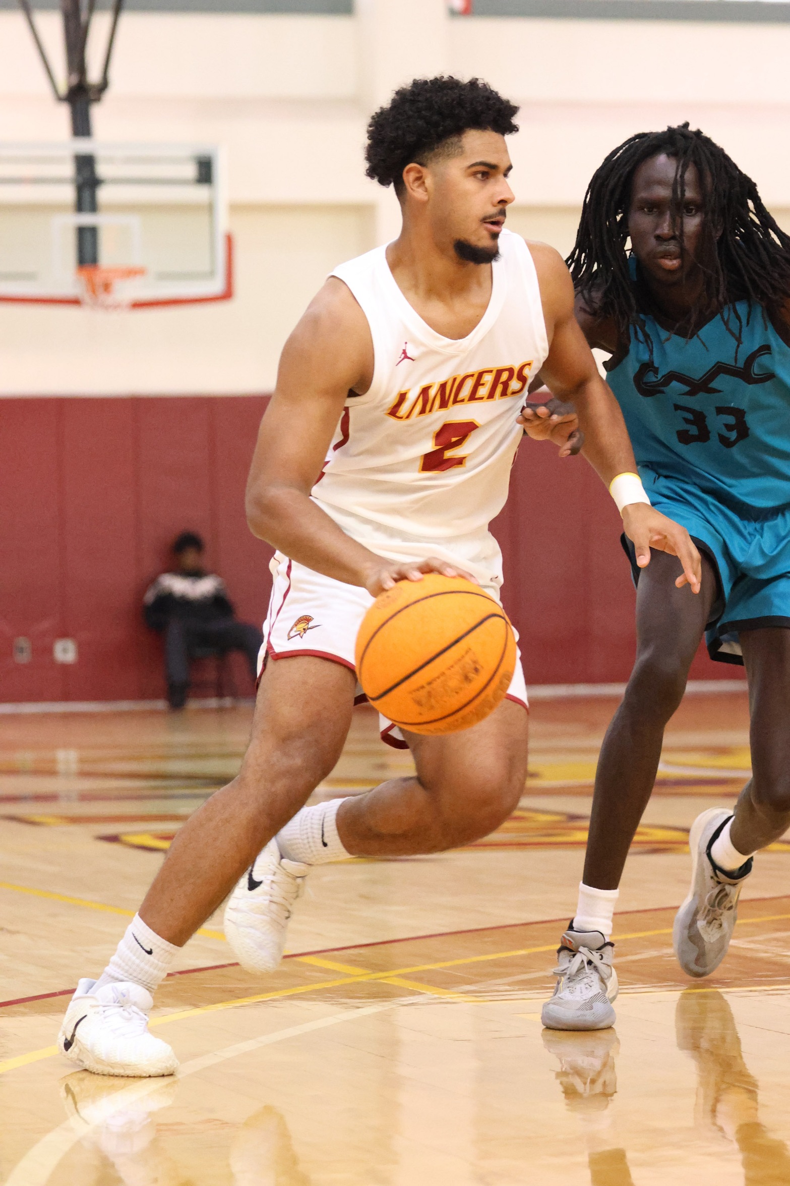 Darrius Freeman dribble drives during Monday's win (photo by Richard Quinton).