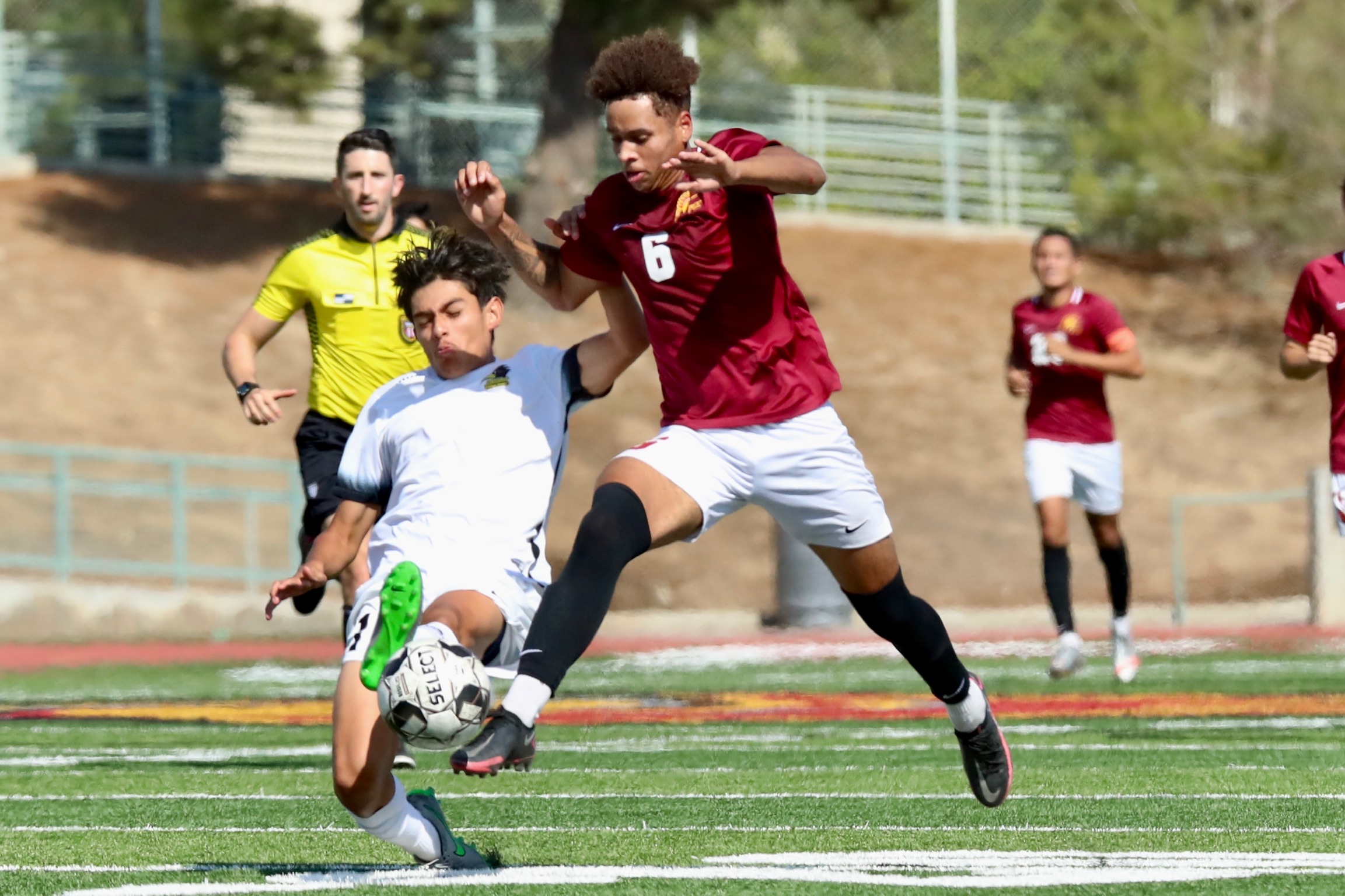 Lancer Nicholas Malooley tangles with a Rio Hondo player during PCC's loss at Robinson Stadium on Tuesday (photo by Michael Watkins).