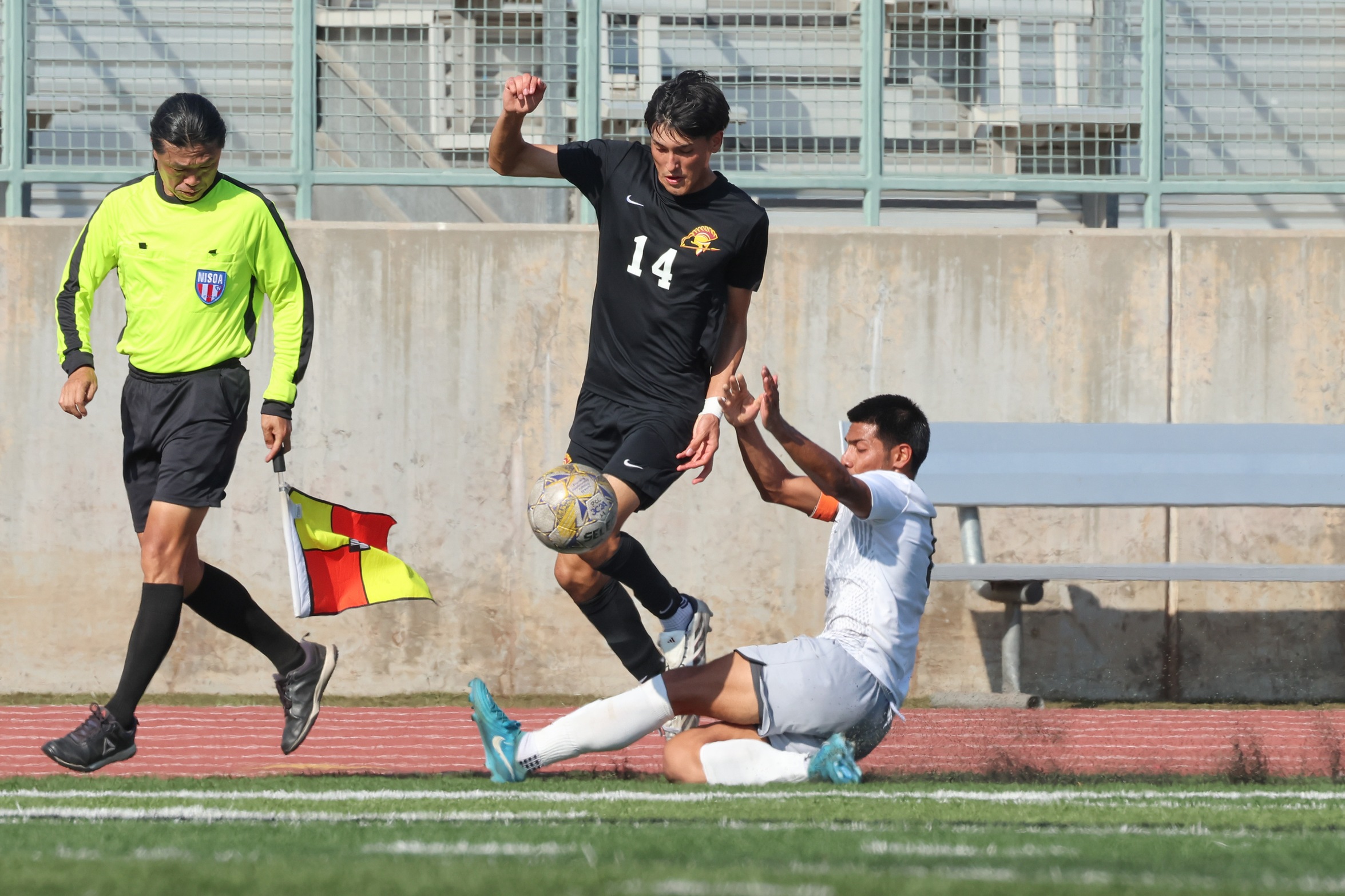 Angel Ballesteros battles for the ball in Friday's win (photo by Richard Quinton).