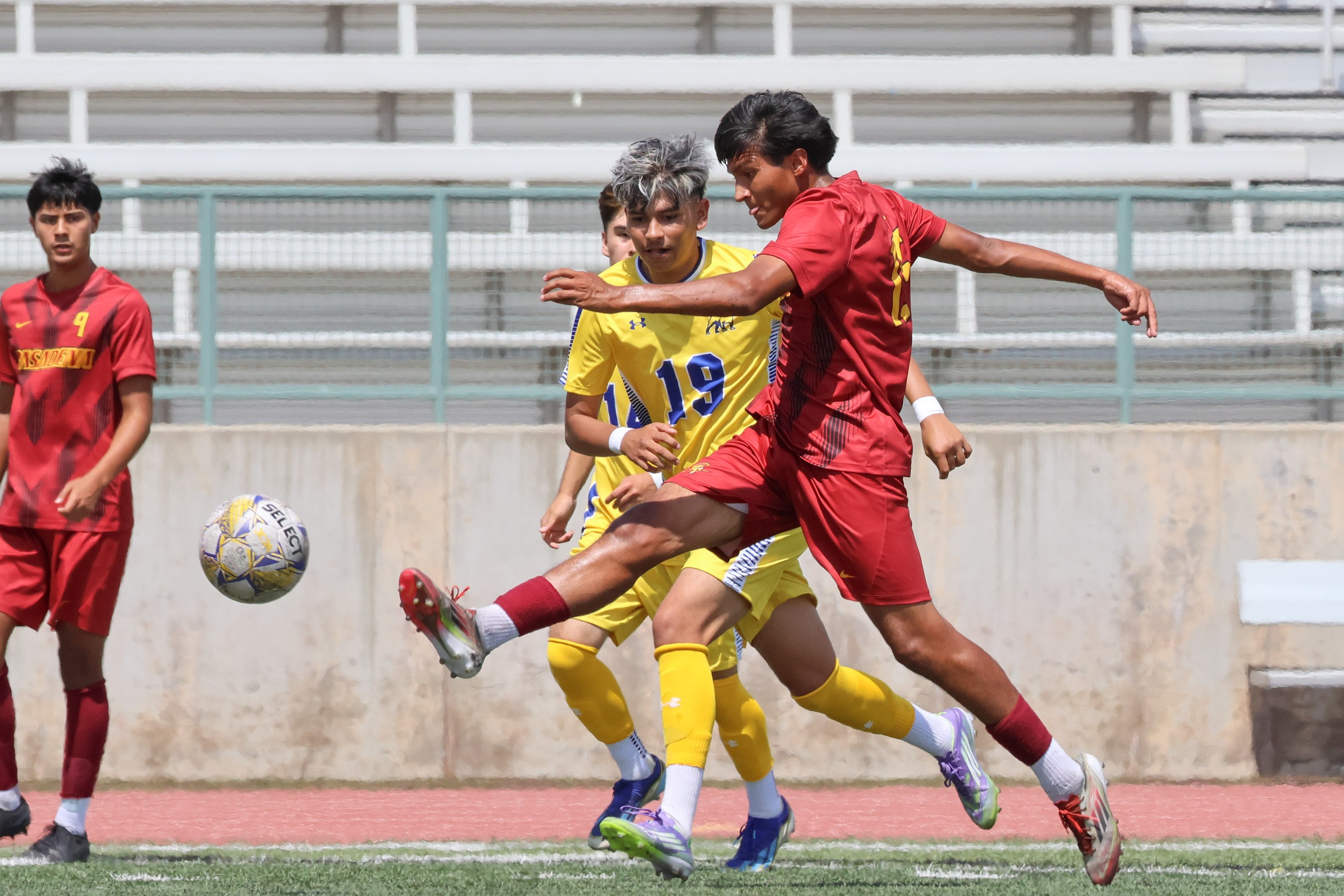 PCC's Julian Zuniga races with the ball in Tuesday's tie (photo by Richard Quinton).
