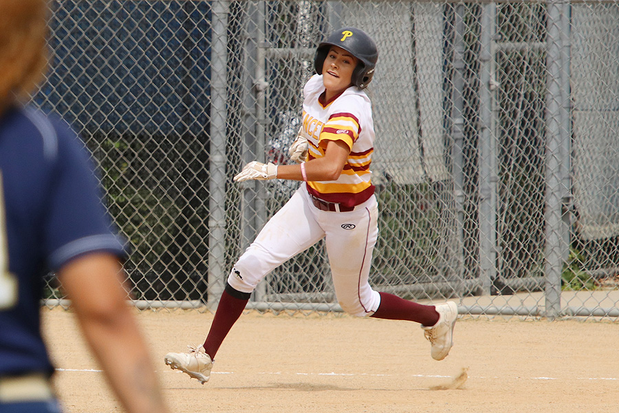 All-time runs leader Karina Moreno scores her record 46th run, photo by Richard Quinton.