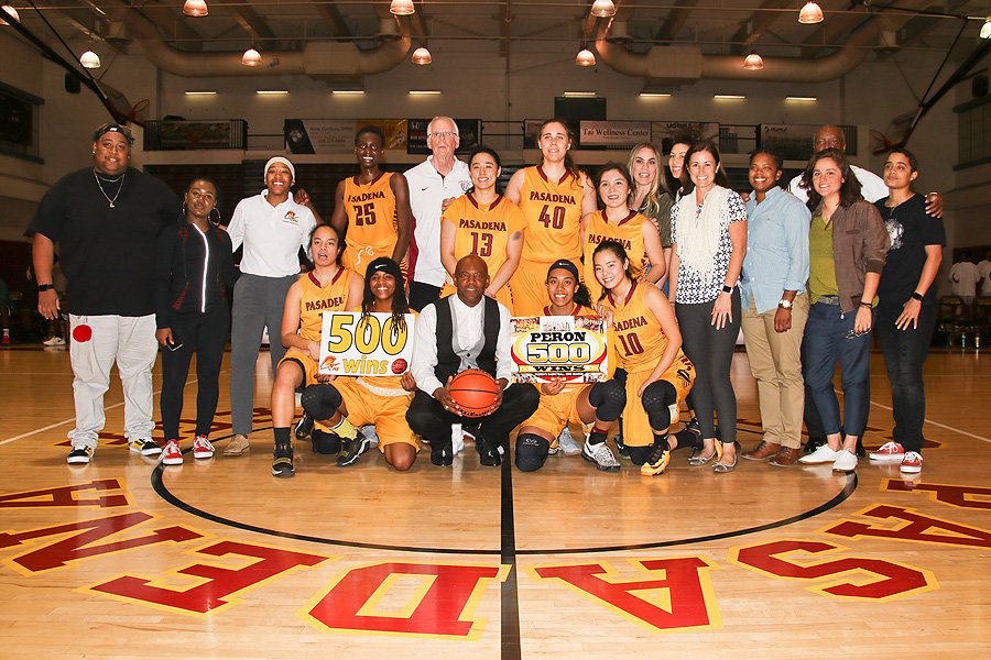 Joe Peron (center with ball) celebrates his 500th career victory as PCC women's basketball coach Friday night at Hutto-Patterson Gymnasium, photo by Richard Quinton.