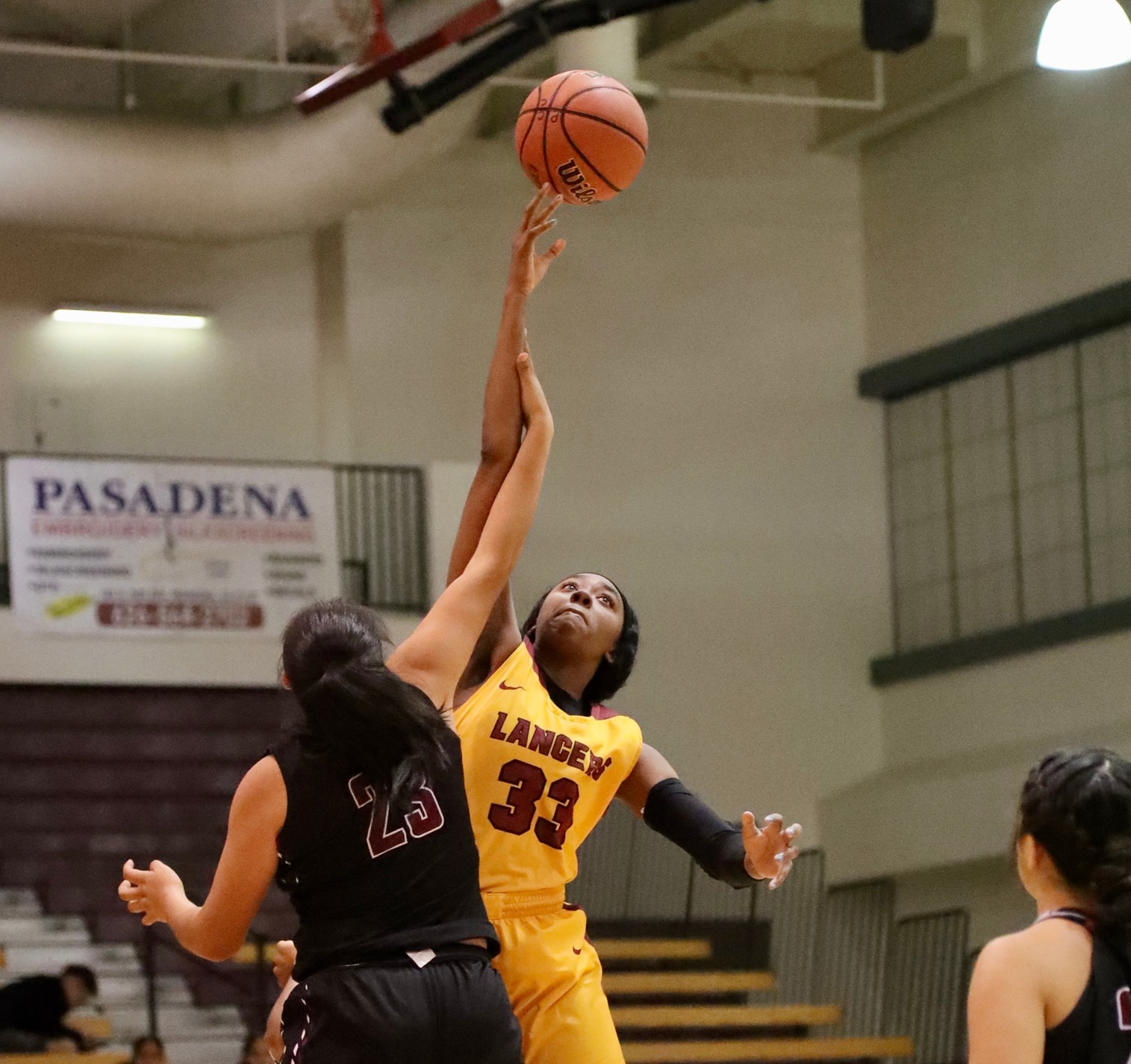 Dariel Johnson goes up for the loose ball against San Diego City on Friday night, photo by Michael Watkins.