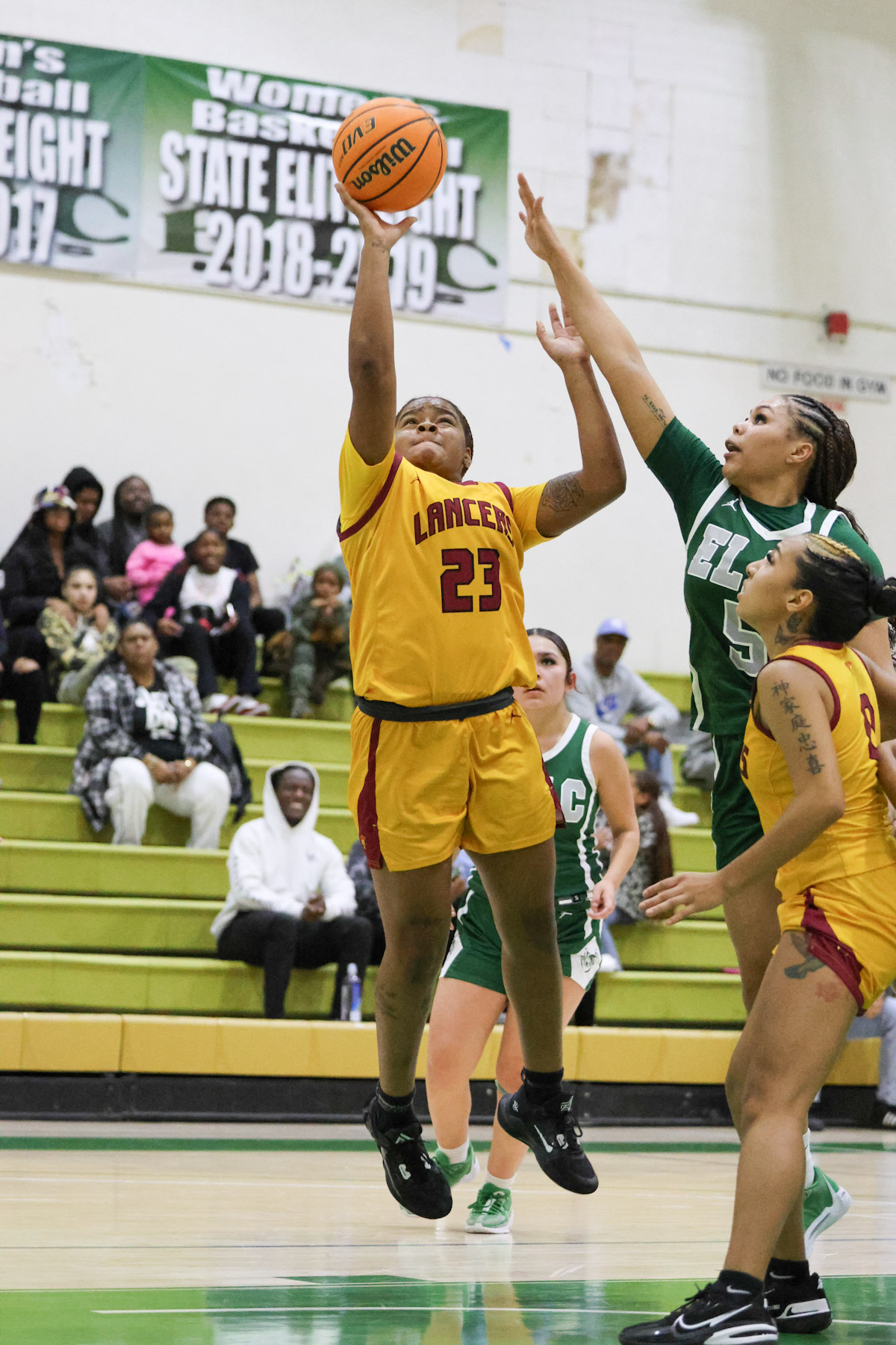 "Twin" Garrett goes up for the shot in Friday's win at East LA College (photo by Richard Quinton).