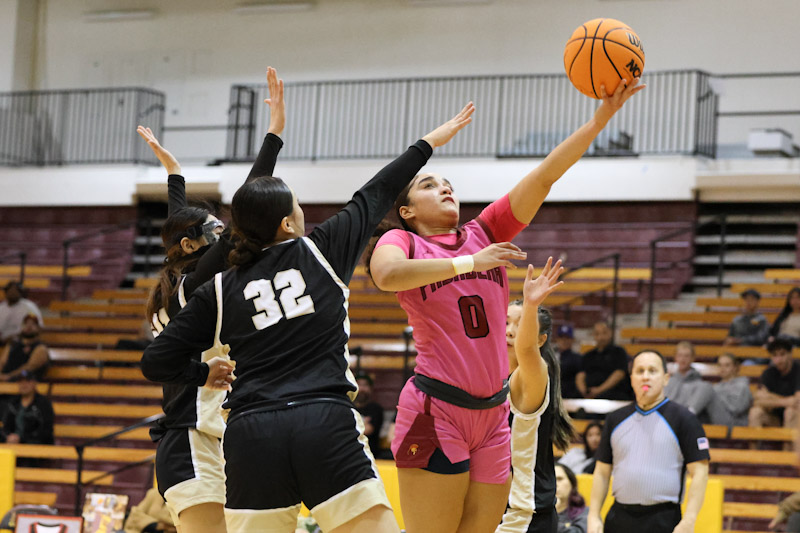 Monica Menzies goes to the basket in the Lancers home season finale on Wednesday (photo by Richard Quinton).