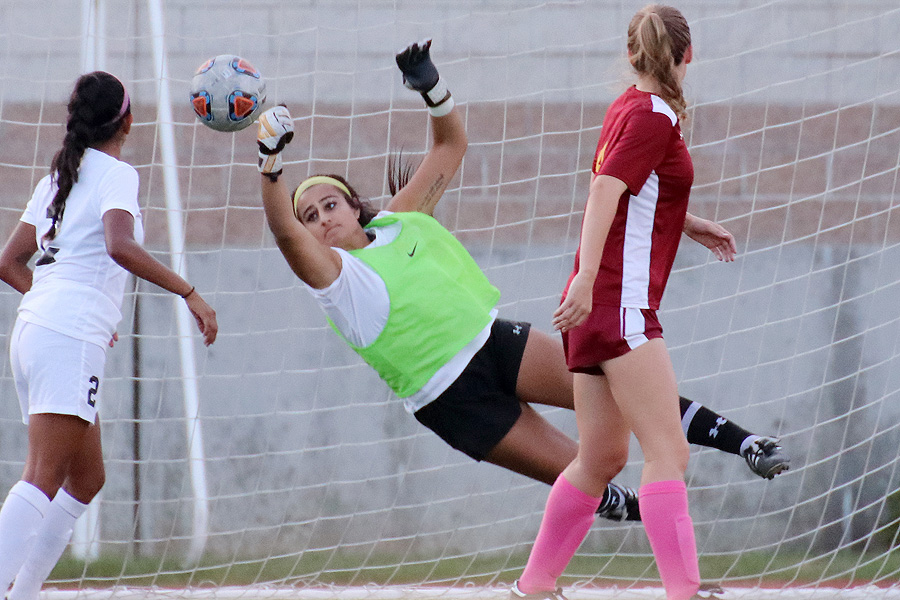 Lancer goalie Lilly Urumieh makes a great save during PCC's 1-1 tie v. Long Beach City College on Tuesday at Robinson Stadium, photo by Richard Quinton.