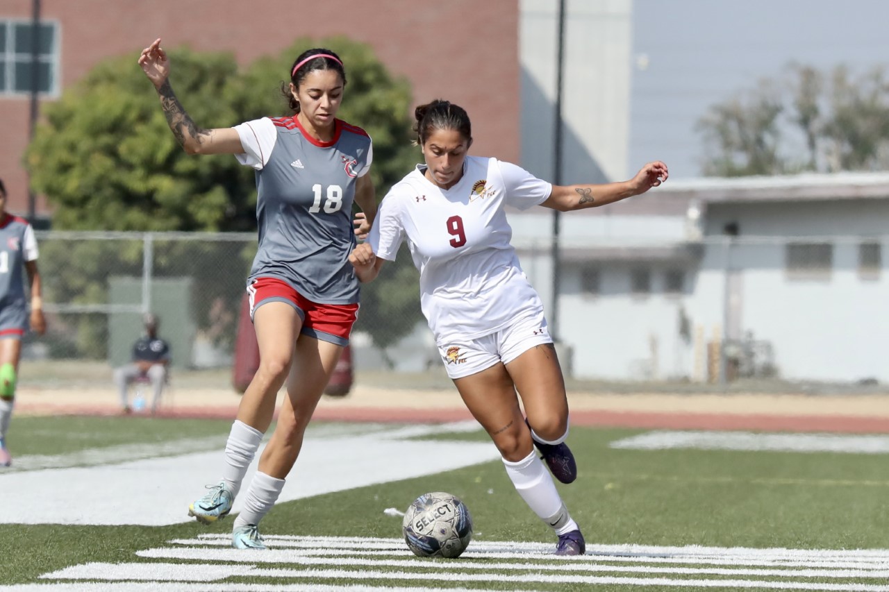 Mia Bedoyan carries the ball during PCC's win at Compton (photo by Michael Watkins).