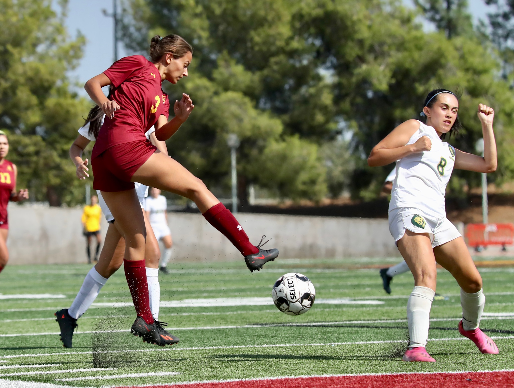 Athena Vournas makes the pass during PCC's win over LA Valley Friday at Robinson Stadium (photo by Michael Watkins).