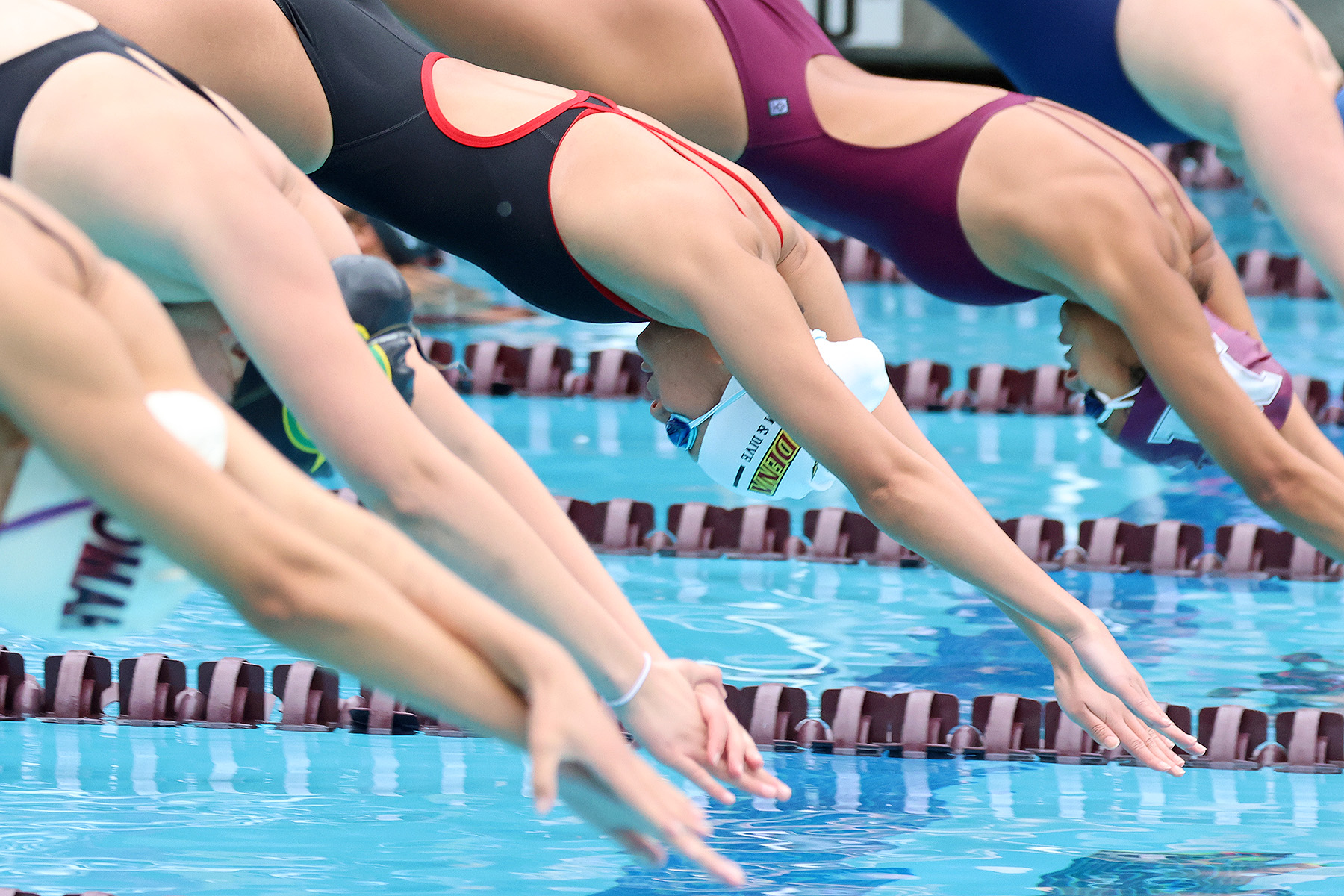 Emily Wang dives in to begin an event on Saturday at Mt. SAC (photo by Richard Quinton).