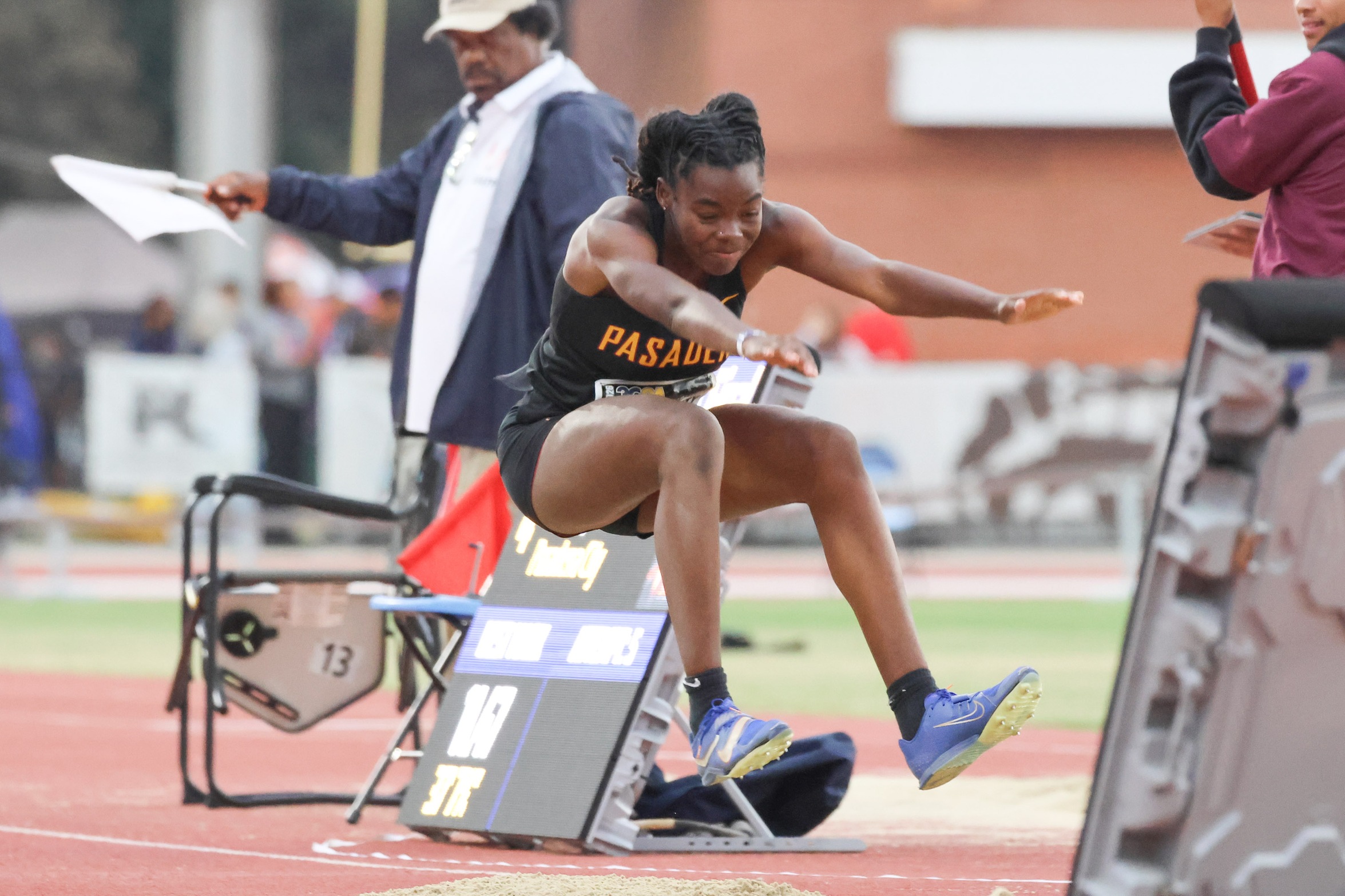 Destiny Rayburn during a jump at Saturday's 3C2A State Meet (photo by Richard Quinton).