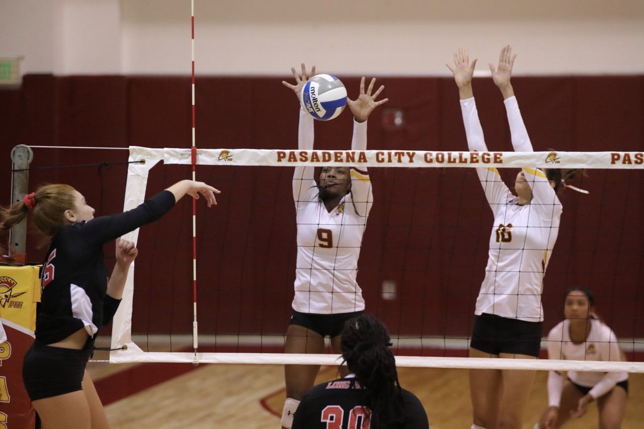 Erykah Wilson blocks an attempt with teammate Paulina Lopez helping out during Wednesday's Lancers loss v. Long Beach, photo by Michael Watkins.