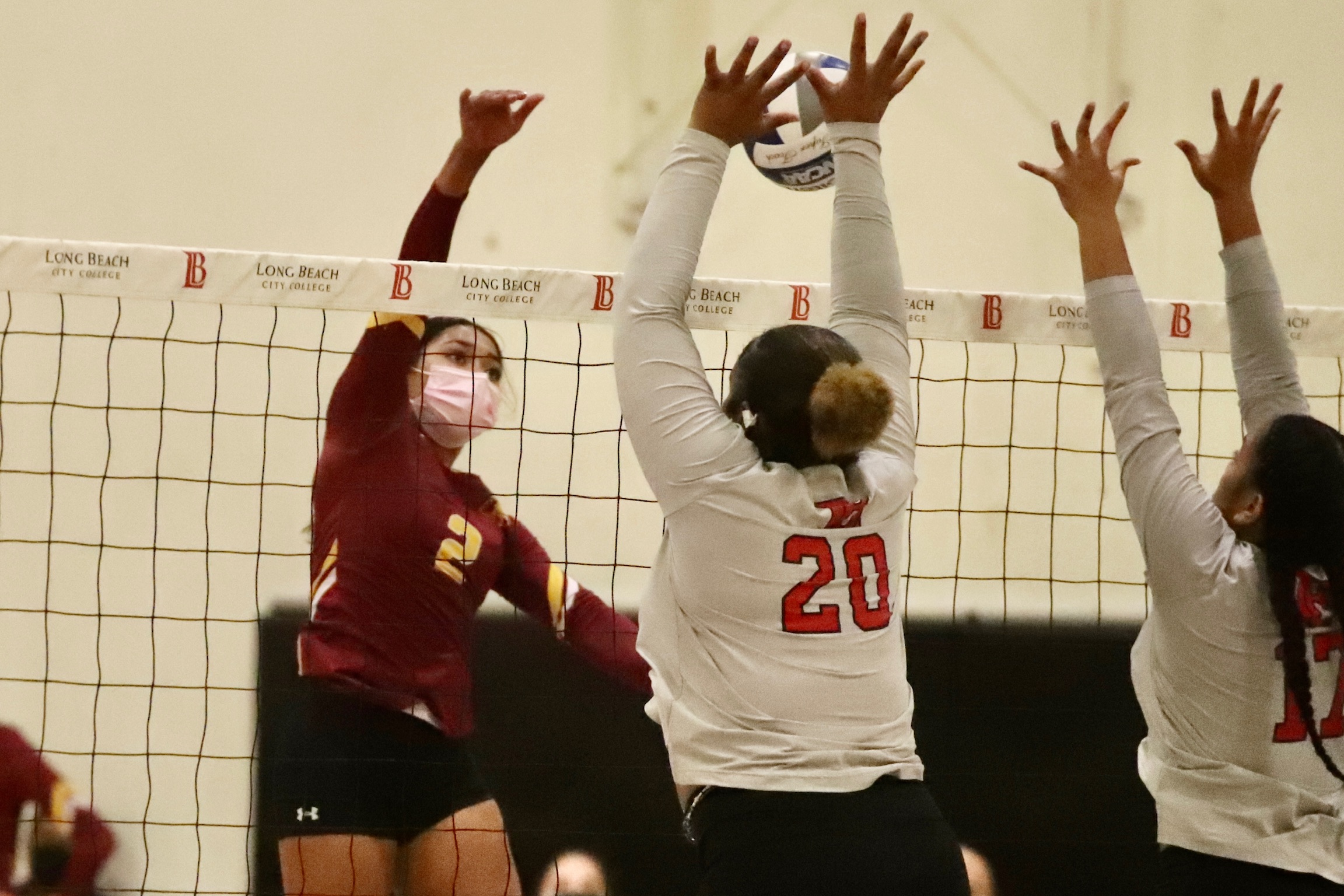 Sabiya Esquivel (#2) drives an attack at Long Beach City College on Friday night (photo by Michael Watkins).