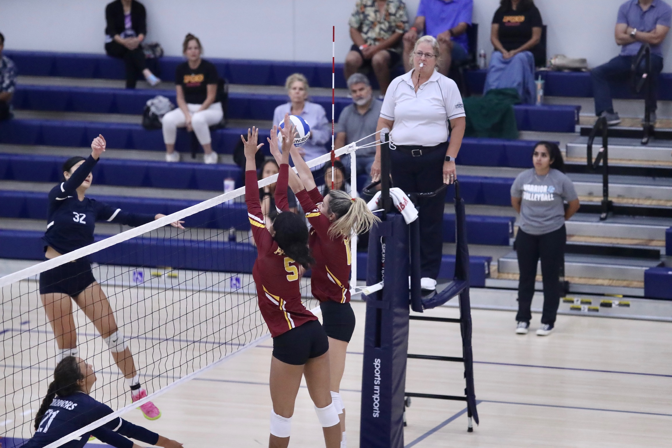 Ashley Gilbert (5) and Bia Silva go up for a block during PCC's loss at El Camino on Friday night (photo by Michael Watkins).