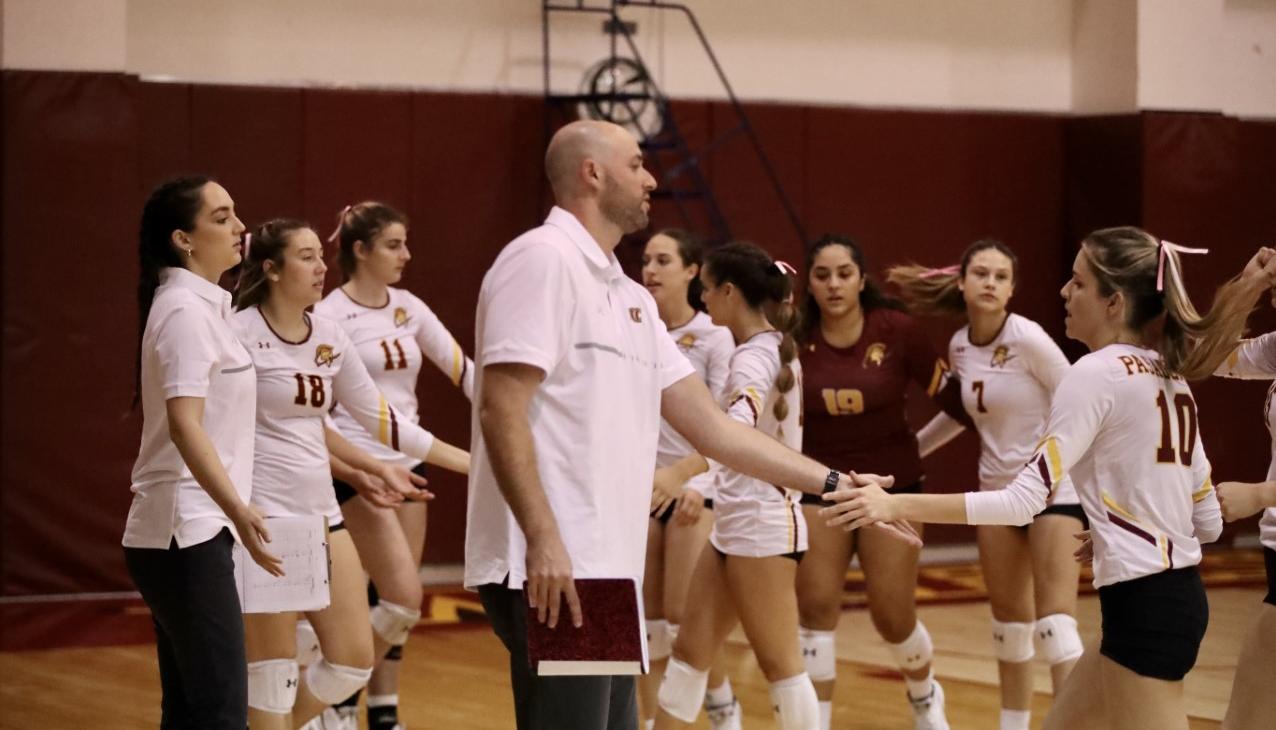 Head Coach Mike Terrill appreciates the play of Bia Silva (10) during his 100th career victory on Friday (photo by Michael Watkins).