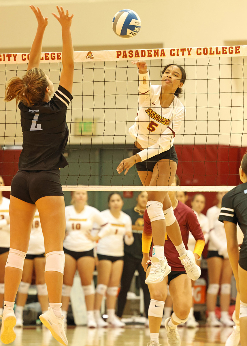 Ashley Gilbert puts away a kill during PCC's season-opening win on Friday (photo by Richard Quinton).
