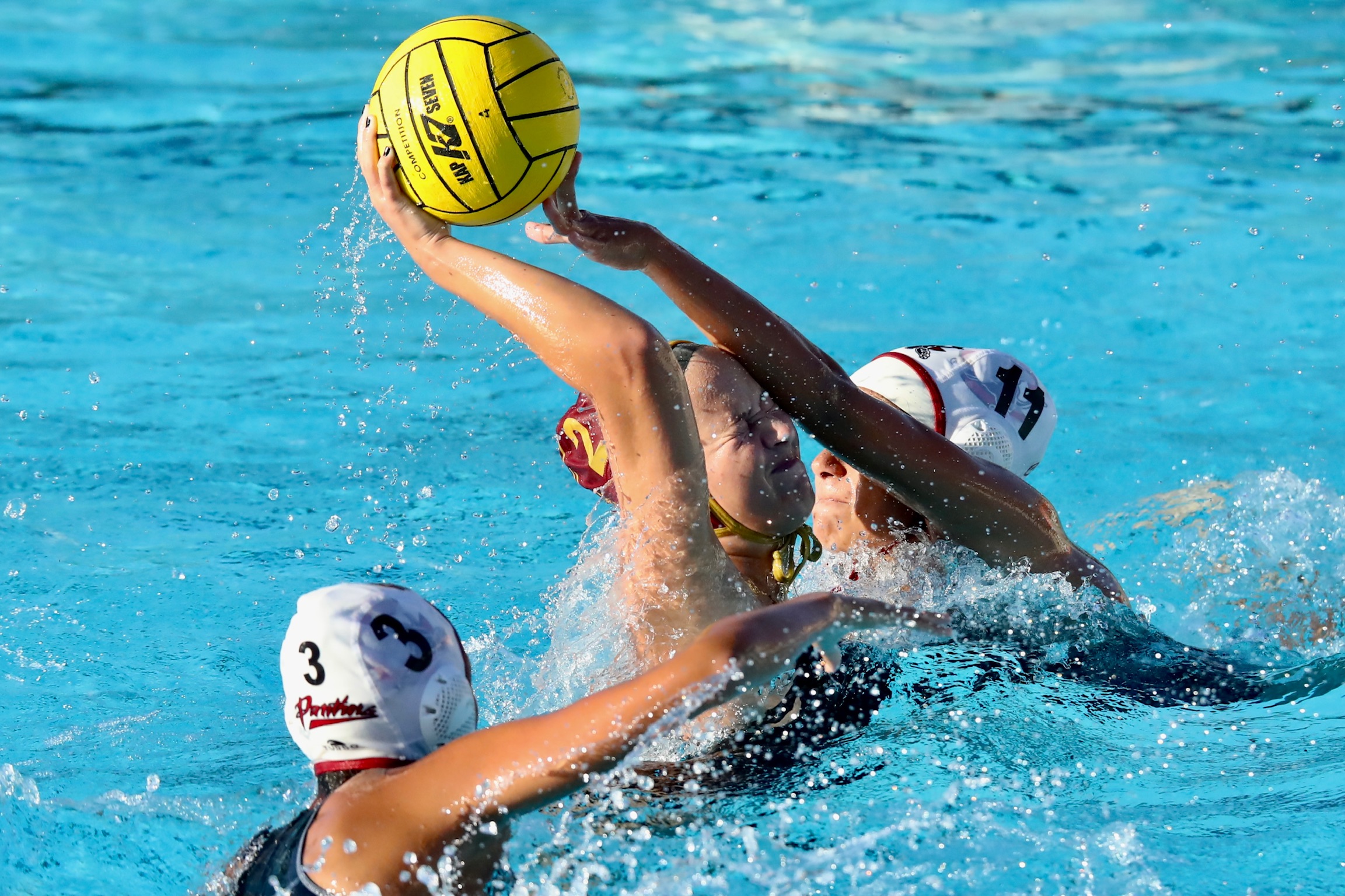 Lilah Caputi (#2) braces herself while trying to make a throw with a Chaffey player defending during PCC's loss to Wednesday at Polytechnic School (photo by Michael Watkins)